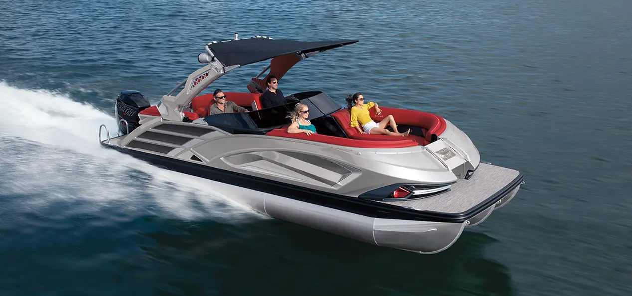 Bennington QX Sport pontoon cruising across a lake