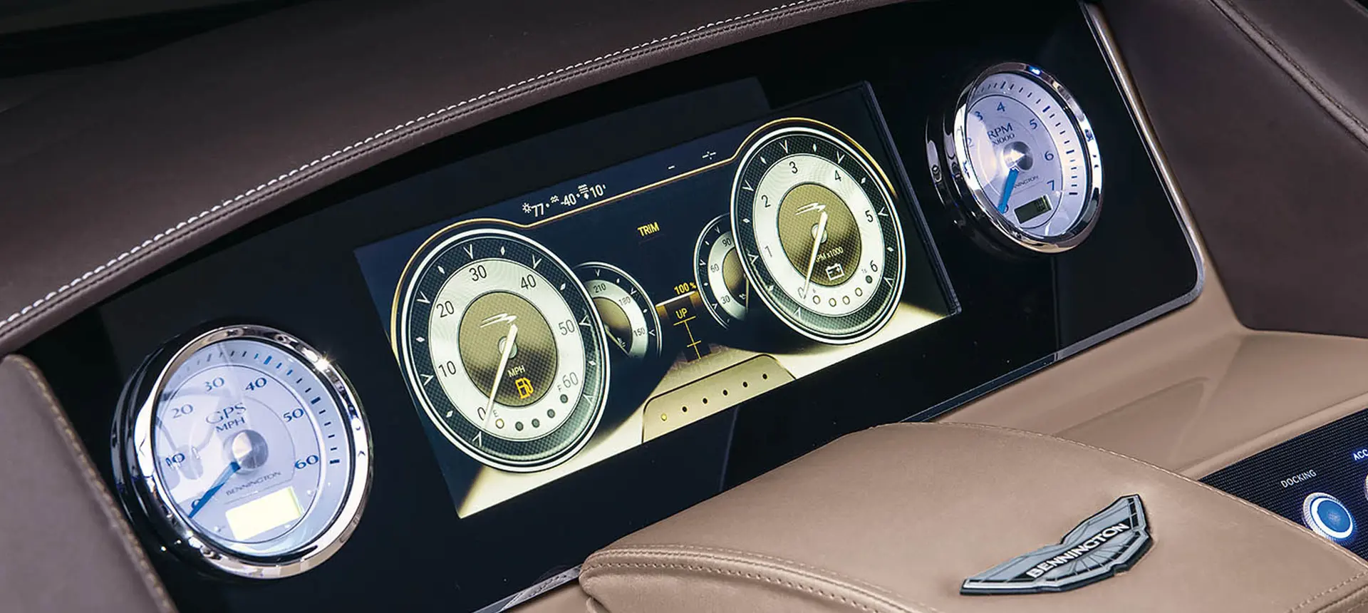 digital gauges on the helm of a bennington qx sport pontoon boat