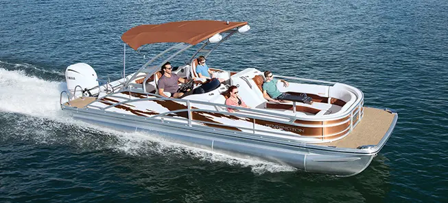 A family enjoying a ride on their Bennington R Bowrider Pontoon Boat