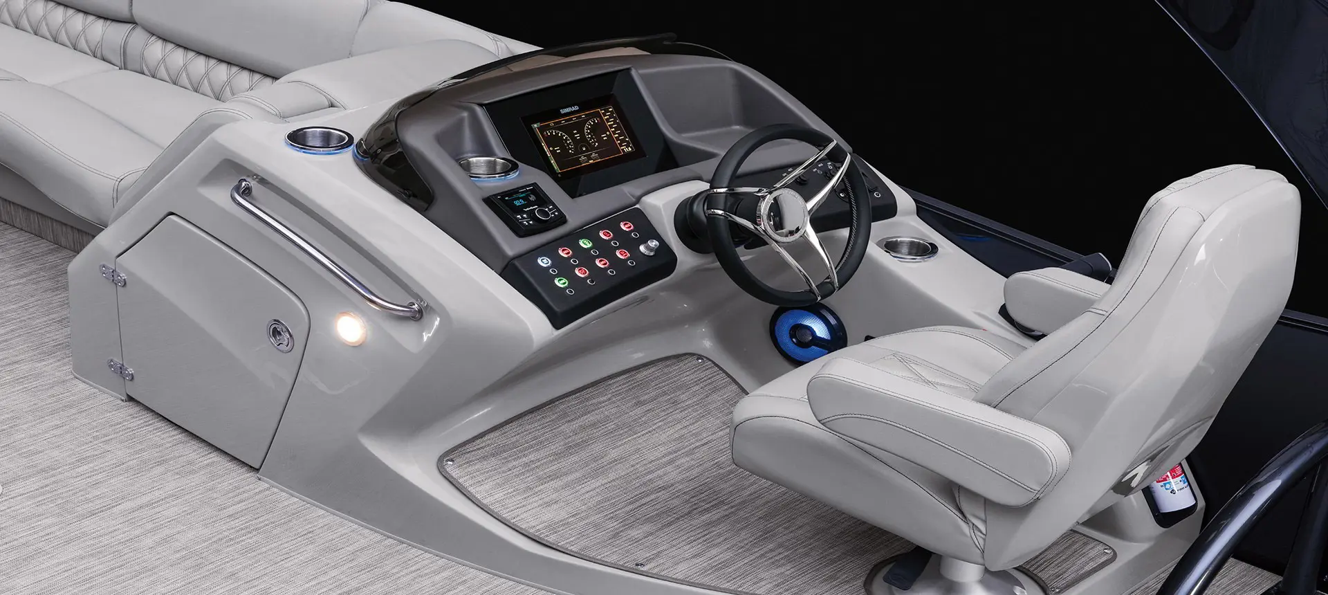 captains chair and steering console on a Benningtor R pontoon