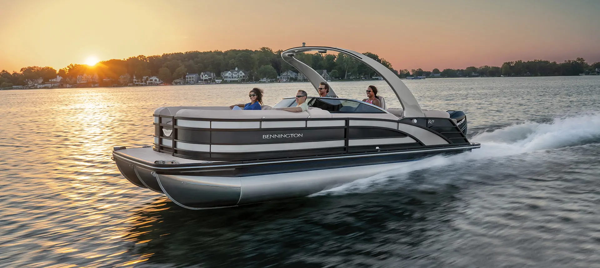 side profile of a Bennington R pontoon cruising on a lake