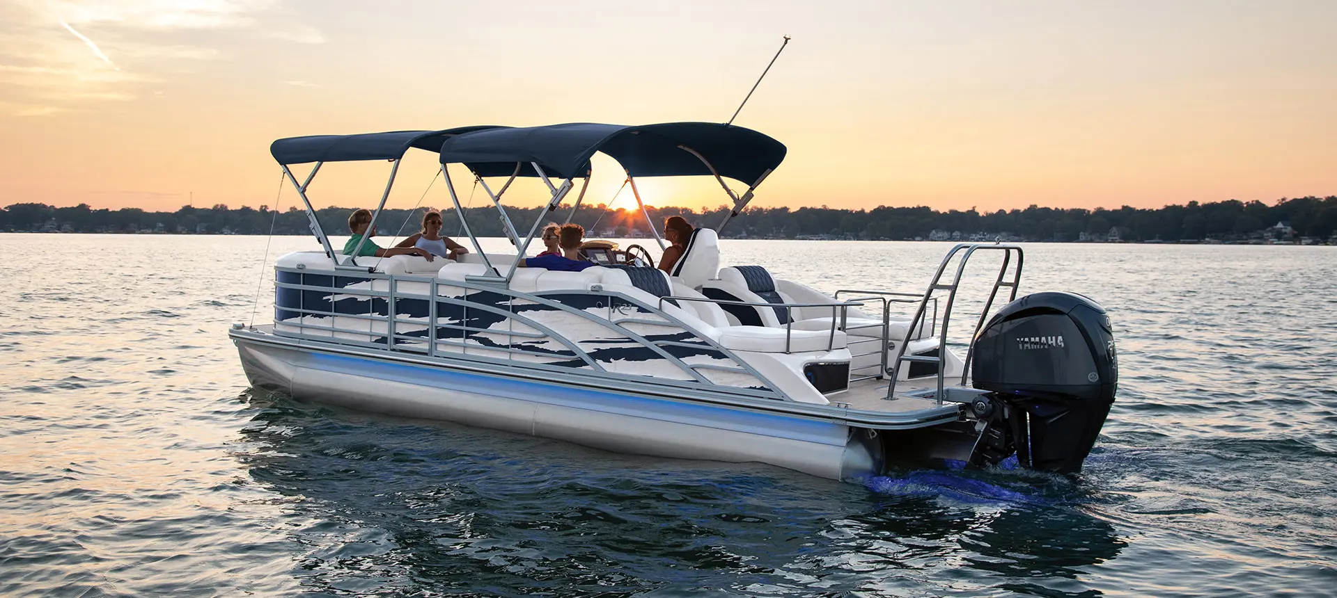 side view of a Bennington R pontoon with the canopy up