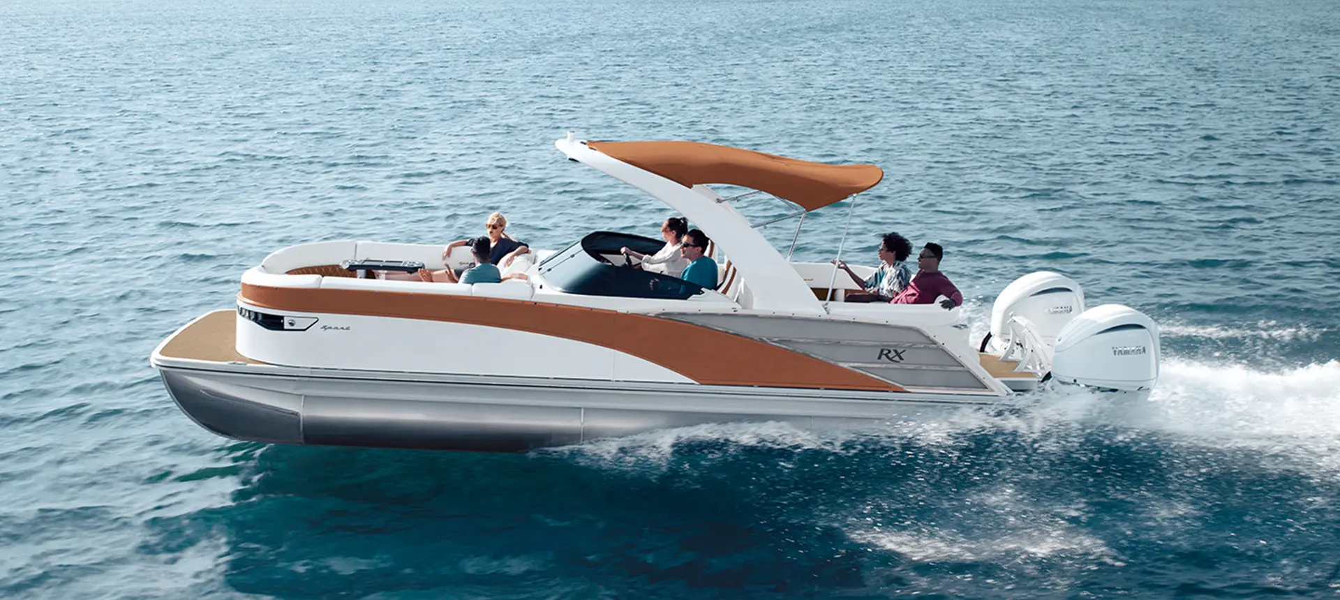 side profile of a bennington rx sport pontoon boat on a lake