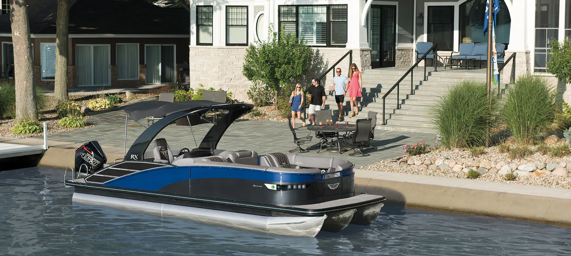 people walking towards a docked bennington rx sport pontoon boat