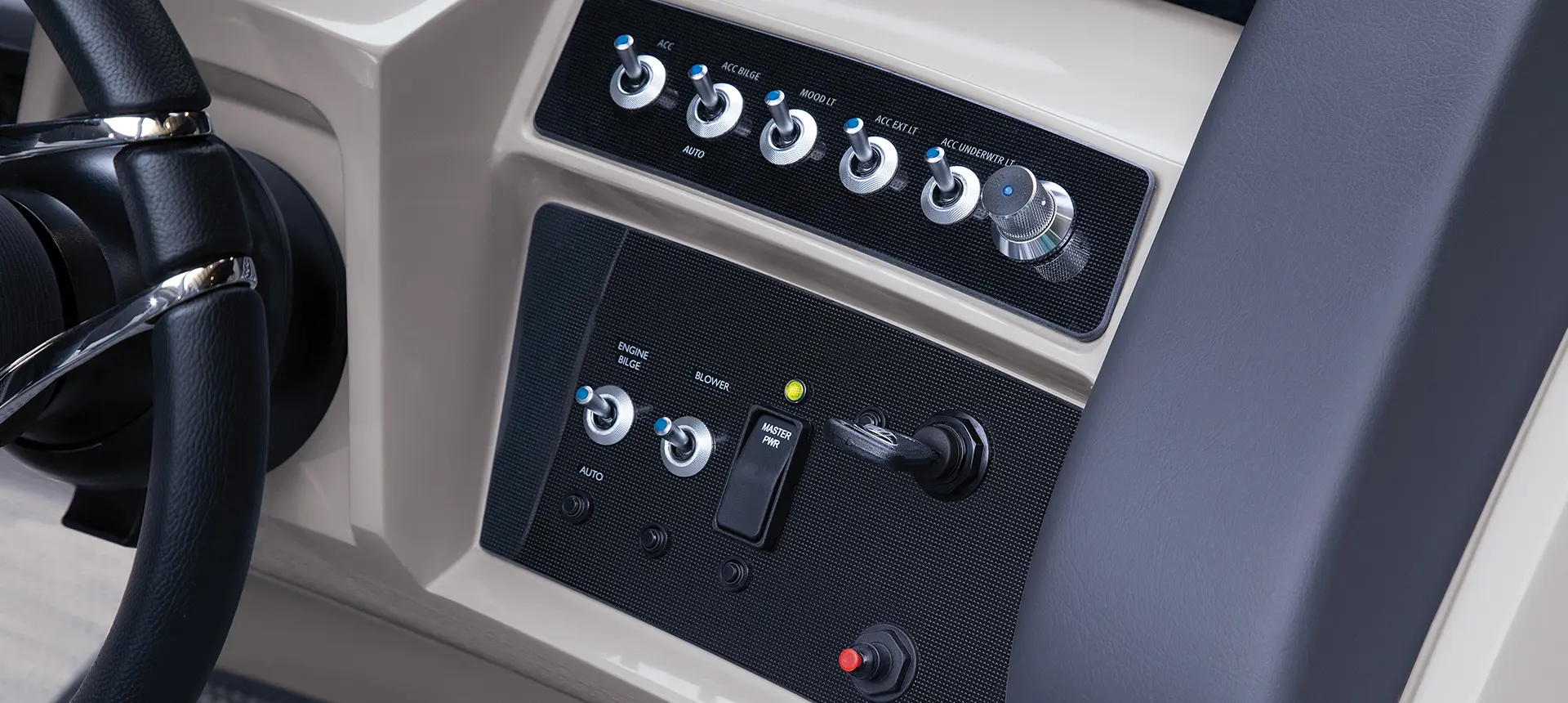 switches and ignition on the helm of a bennington rx sport pontoon boat