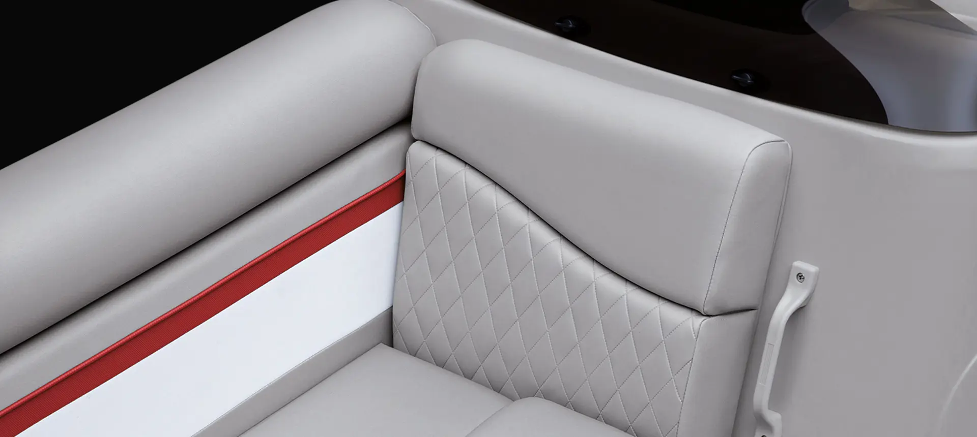 closeup view of the stitching and accents on the seats of a bennington s pontoon boat