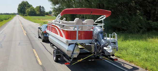 Bennington SV pontoon boat being transported on a trailer