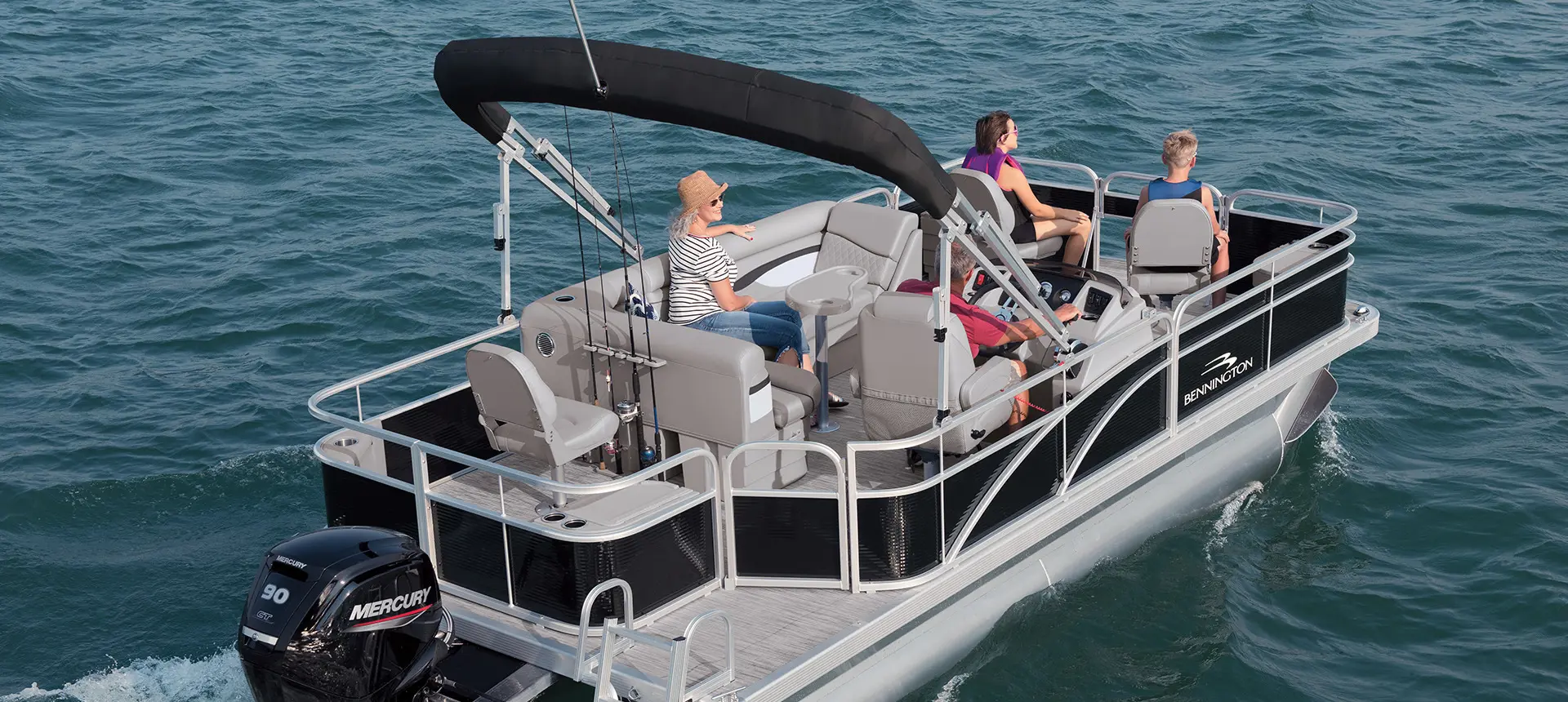 rear view of a Bennington SV pontoon boat floating on a lake