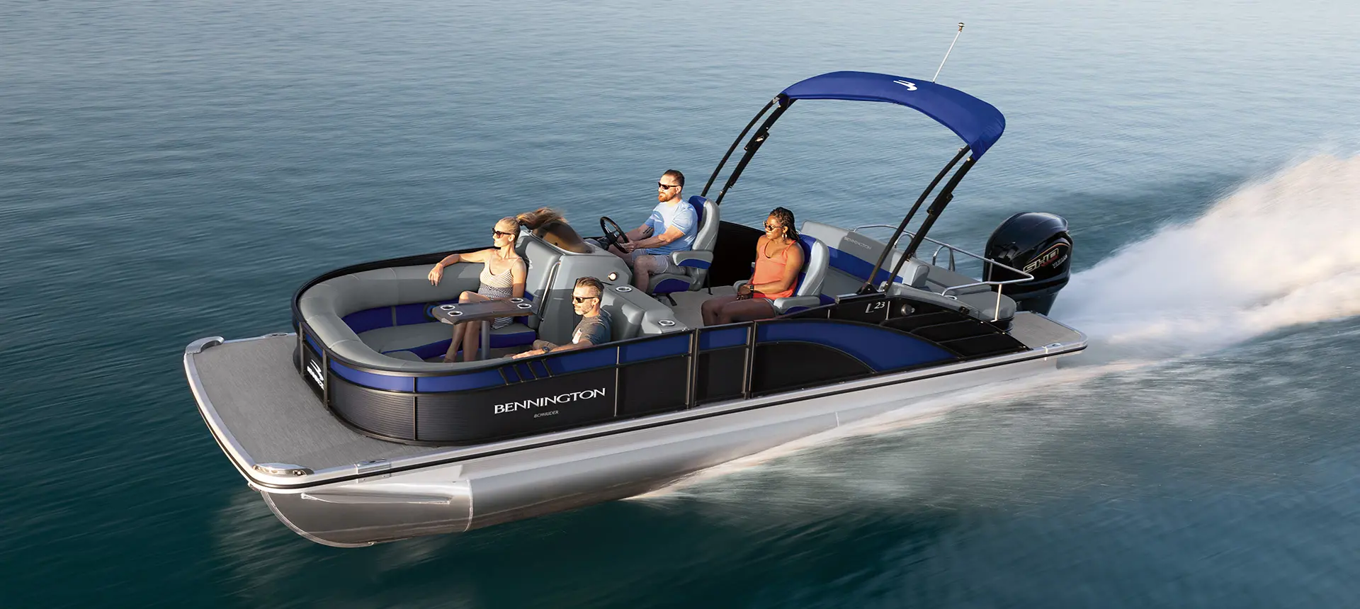 side profile of a bennington l bowrider pontoon boat with swingback seat floor plan cruising on a lake