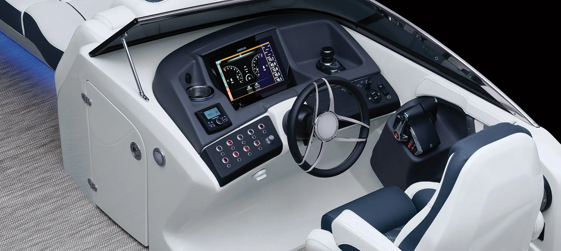 steering wheel, switches and screens on the helm of a bennington q pontoon boat