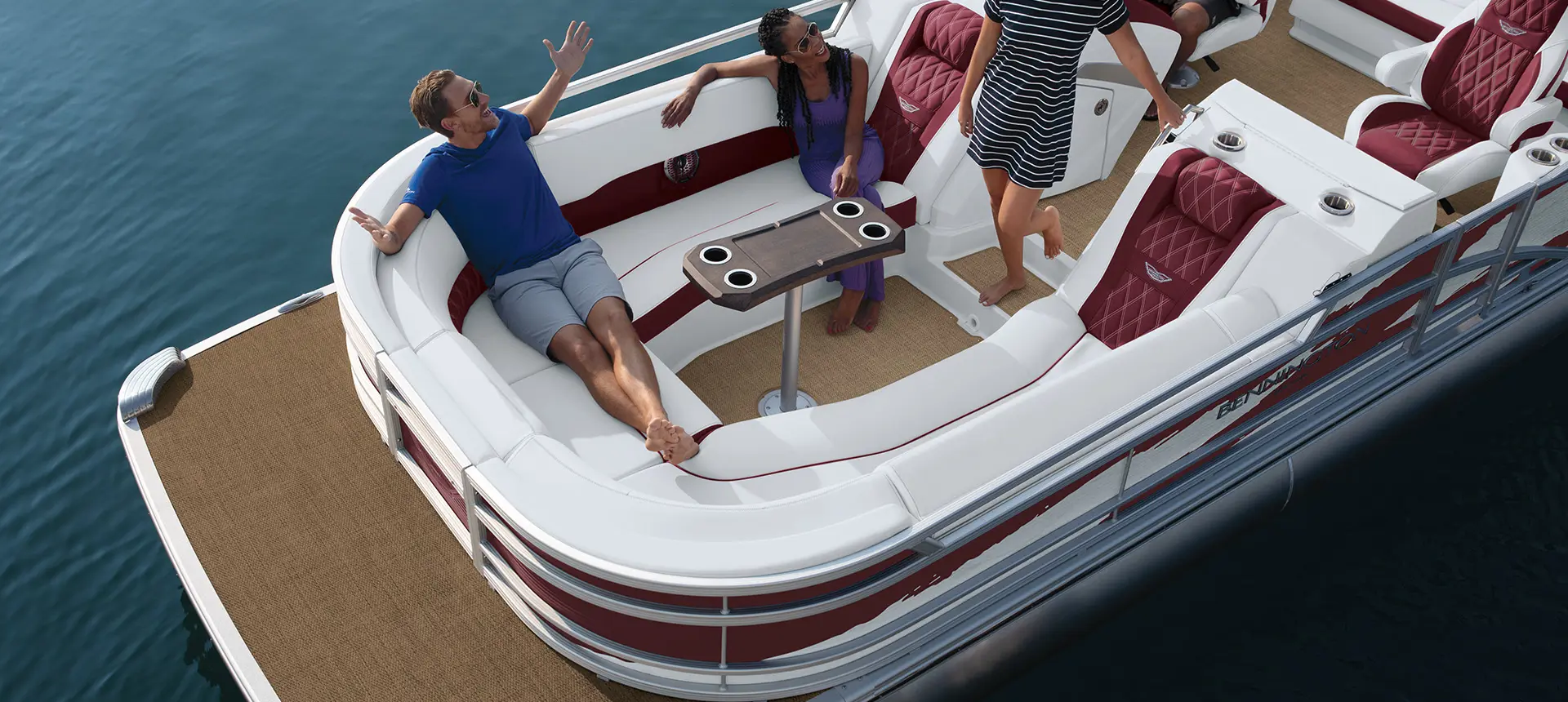 aerial view of people sitting on the bow area of a bennington r bowrider pontoon boat