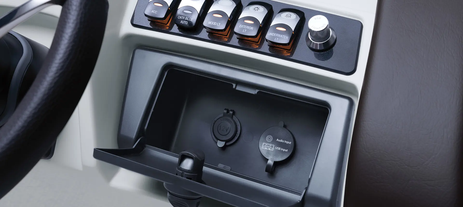 inputs and buttons on the helm of a bennington r bowrider pontoon boat