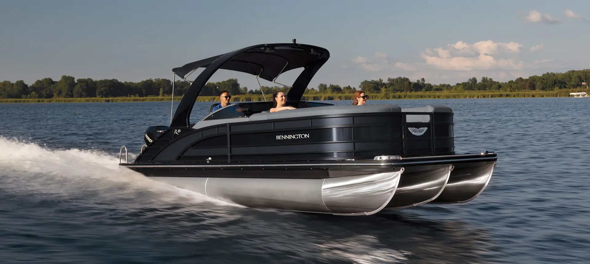 front/side view of a family on a Bennington R pontoon