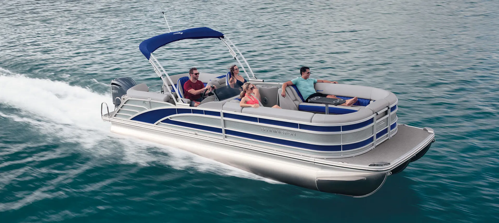 side profile of a Bennington R pontoon on a lake