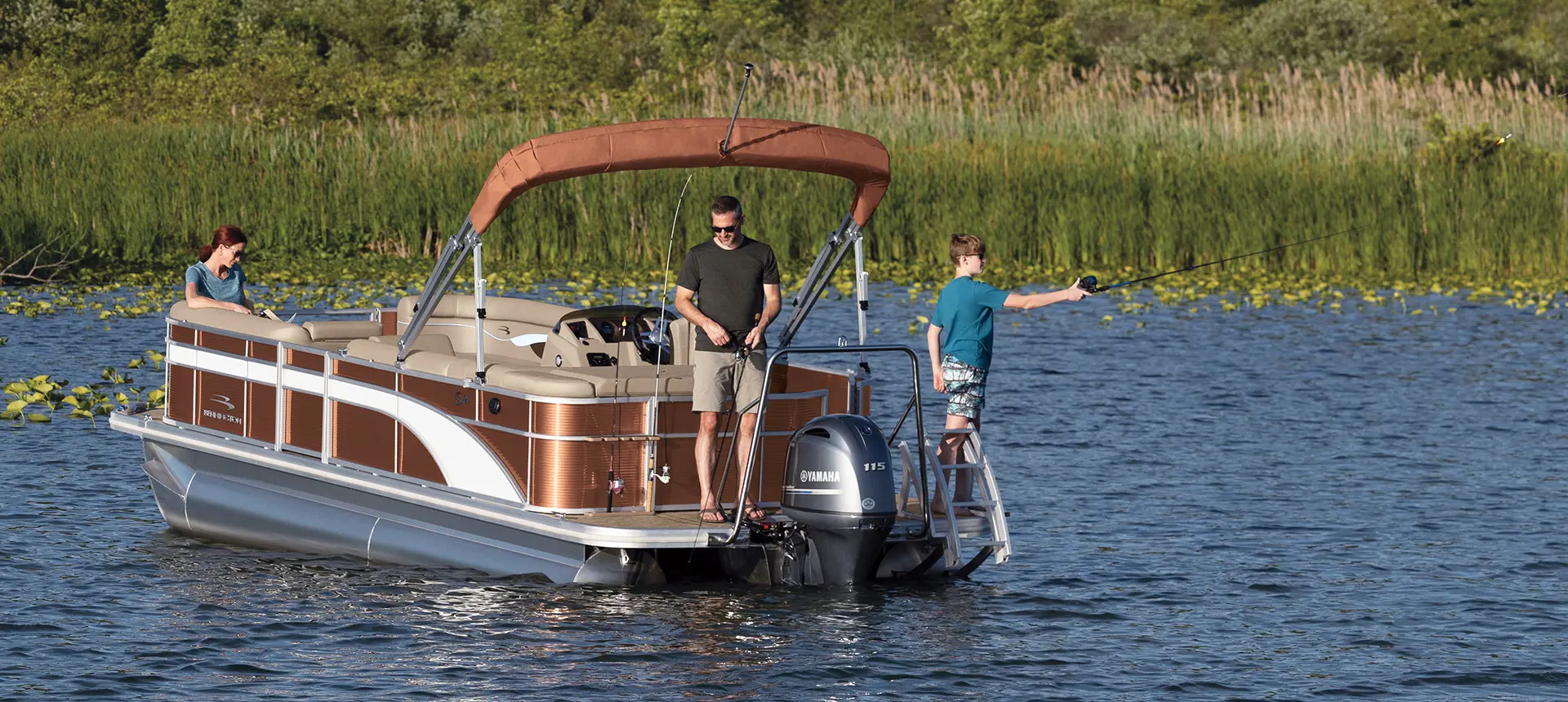 stern view of a family fishing on a bennington s pontoon boat