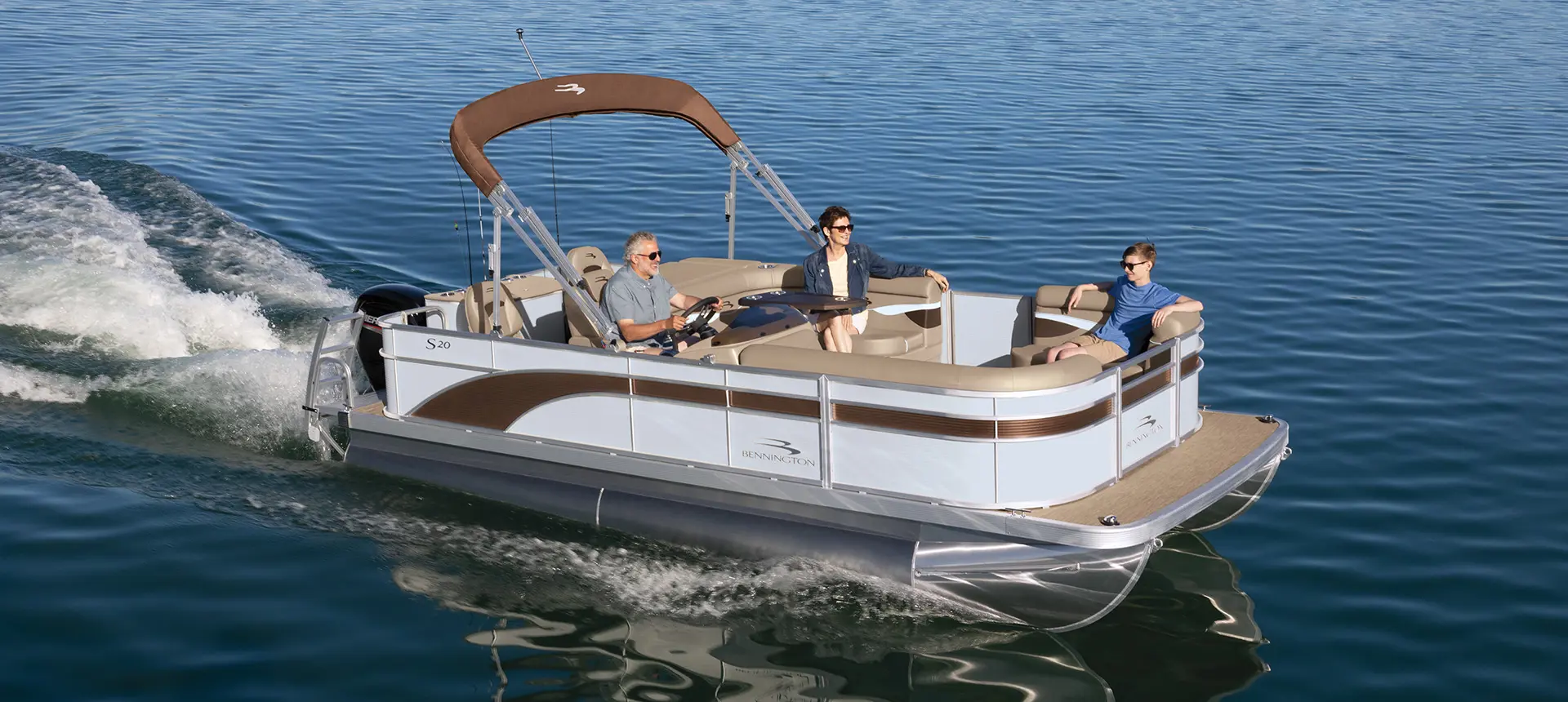 family cruising on a bennington s pontoon boat