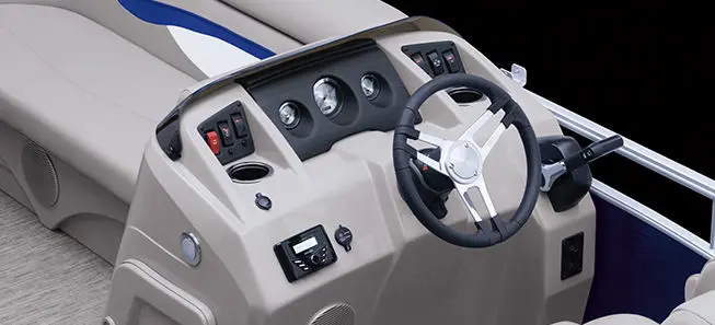steering wheel and gauges on the helm of a Bennington SV pontoon boat
