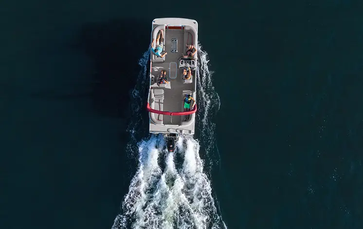 aerial view of a Bennington SV pontoon boat cruising on a lake