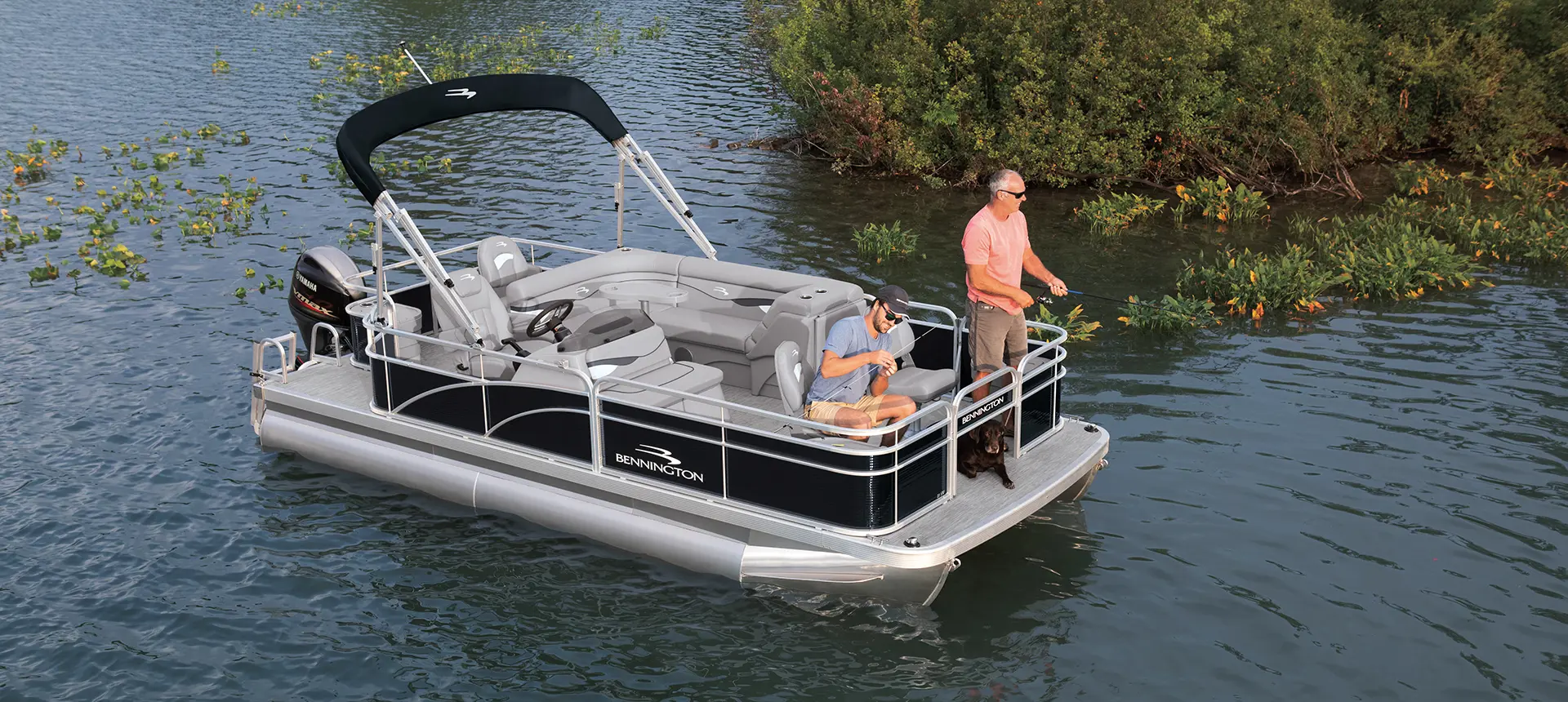 2 men fishing off the bow of a Bennington SV pontoon boat