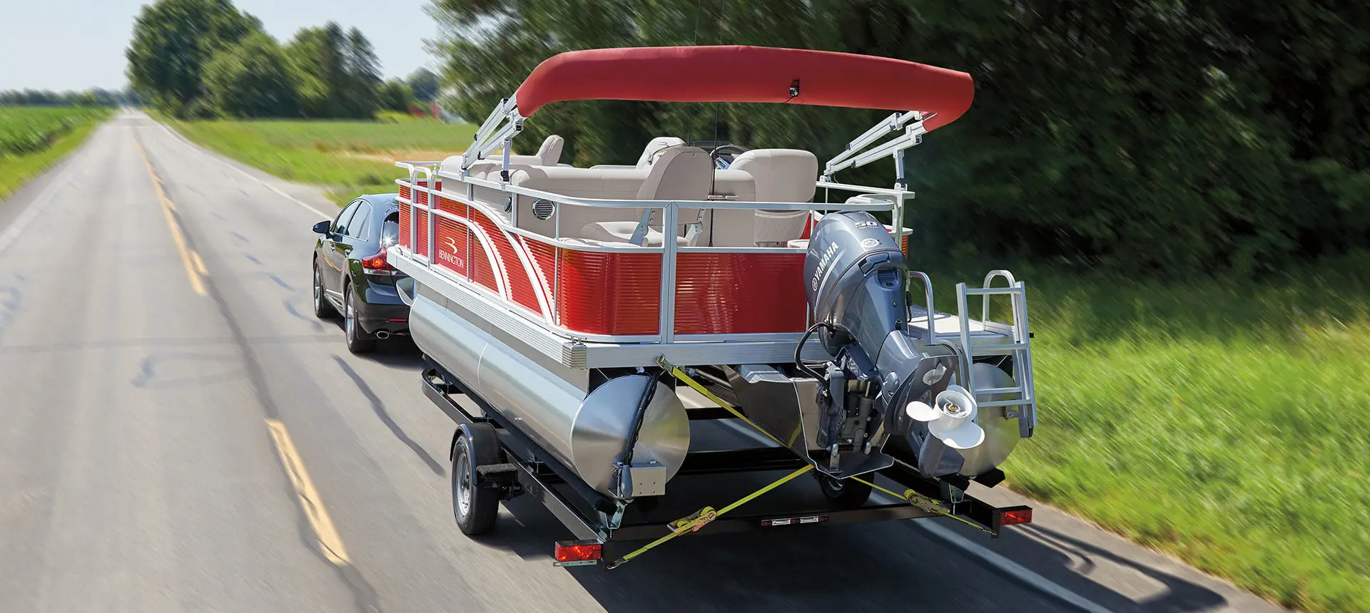 Bennington SV pontoon boat pulled behind a vehicle