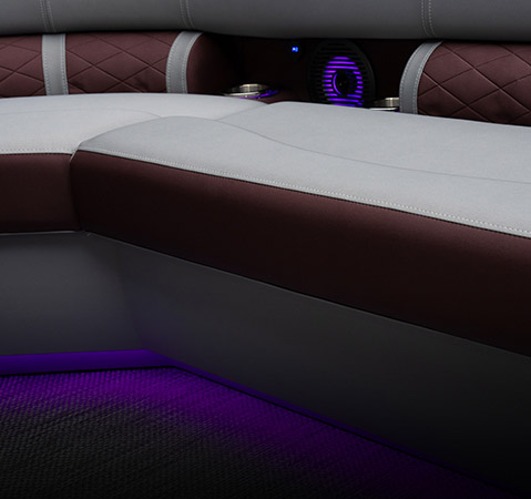 Bennington pontoon with the L-Bench layout showcasing the ambient lighting and integrated speakers.