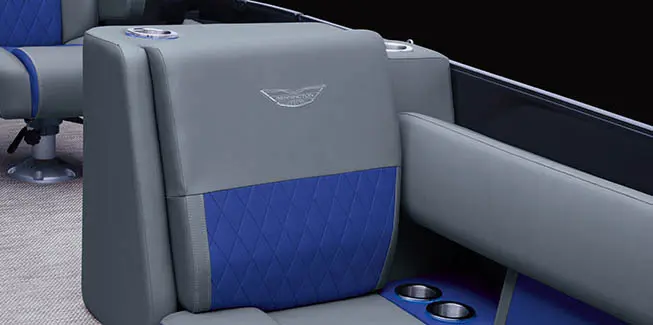 Close-up of the premium stitching on the bow seating and cup holders on a Bennington L Bowrider Line pontoon boat.