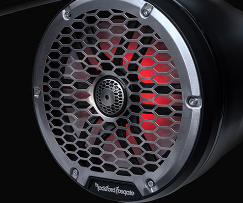 Integrated RGB-illuminated Rockford Fosgate audio speakers on a Bennington LX Sport pontoon boat. 