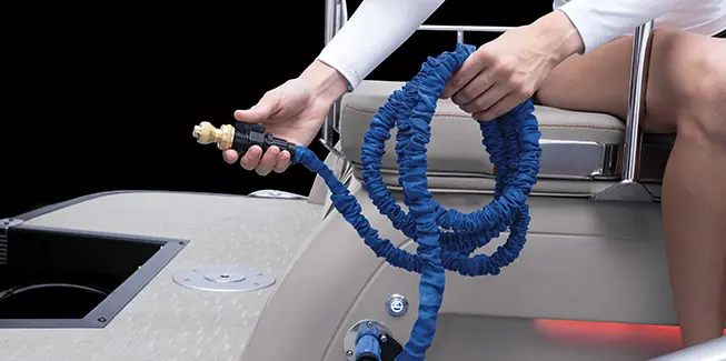 Washdown hose on a Bennington RX Sport pontoon boat.