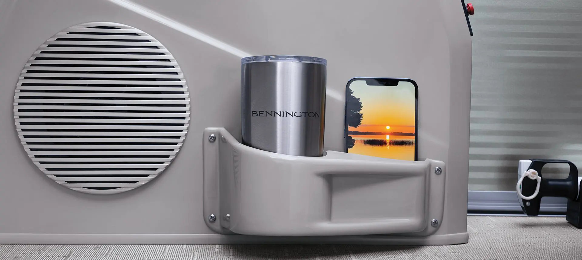 Integrated cup & phone holder on a Bennington SX Line pontoon boat.