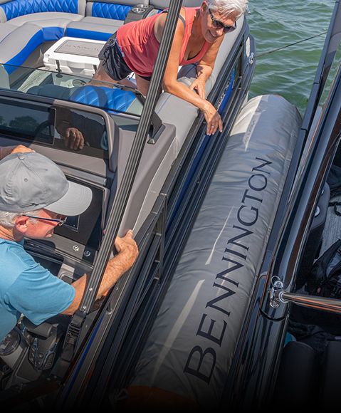 Man docks boat, using Bennington inflatable to avoid damage from the dock. 
