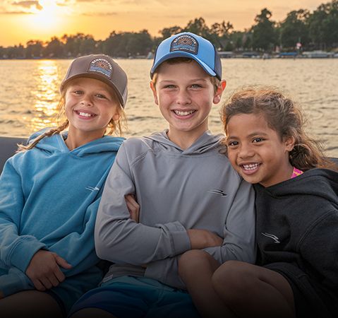 Three kids wearing Bennington branded hoodies.