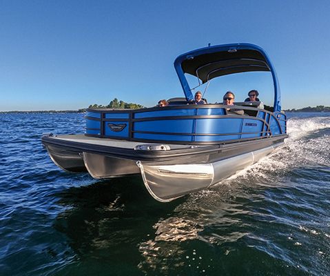 Bennington Bowrider pontoon boat cruising across a lake.