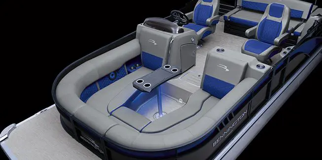 Aerial view of the step-down U-Lounge with table on a Bennington Bowrider pontoon boat.