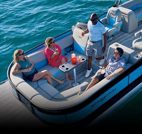 Overhead view of a group relaxing on a Bennington Bowrider pontoon boat.