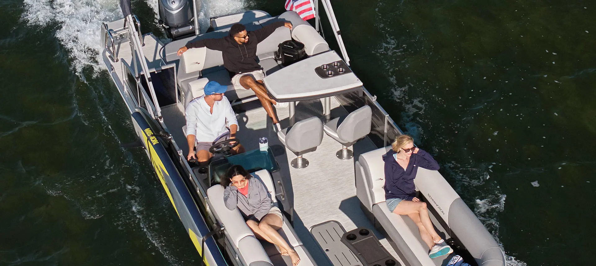 Closeup view of a fishing pole mount attached to pontoon boat using a toolless boat attachment system.