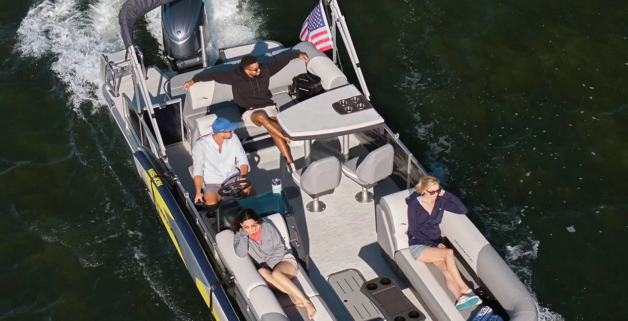 Closeup view of a fishing pole mount attached to pontoon boat using a toolless boat attachment system.