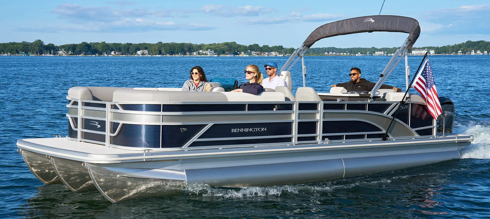 Dog jumping into the water off the stern on a Bennington S Line pontoon boat.