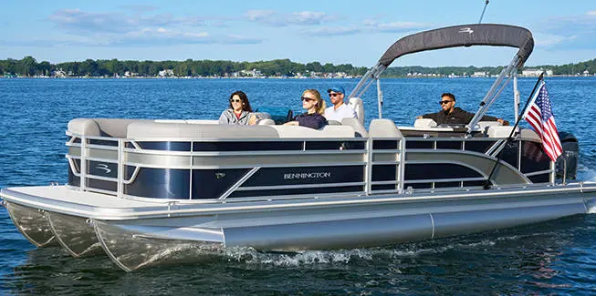 Dog jumping into the water off the stern on a Bennington S Line pontoon boat.