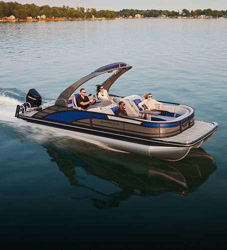 Group of friends cruising on lake on a Bennington Pontoon Boat. 