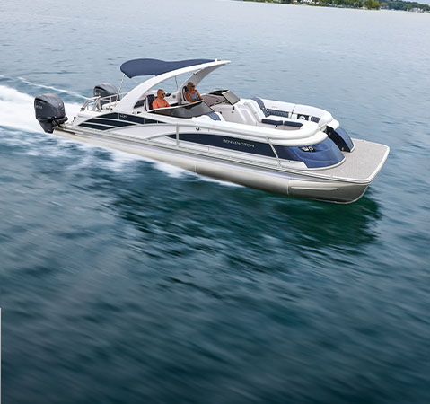 Iconic styling showcased on a Bennington pontoon cruising across a lake. 