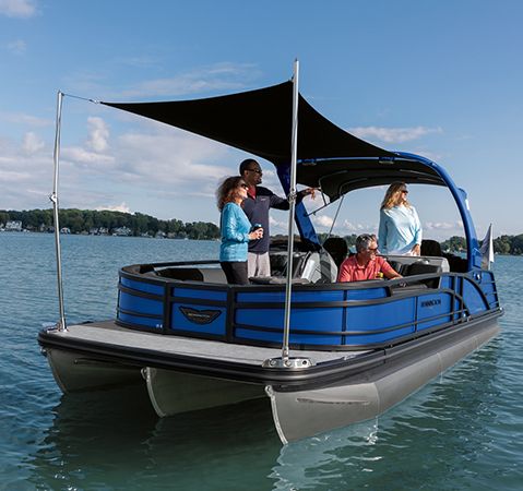 Family enjoying a sunshade power bimini on a Bennington tritoon.