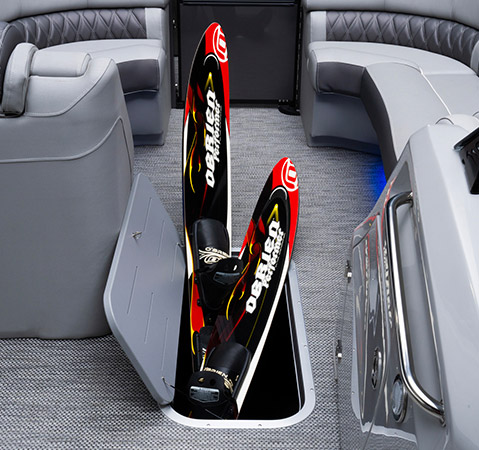 In floor storage on a Bennington Sport Pontoon boat.