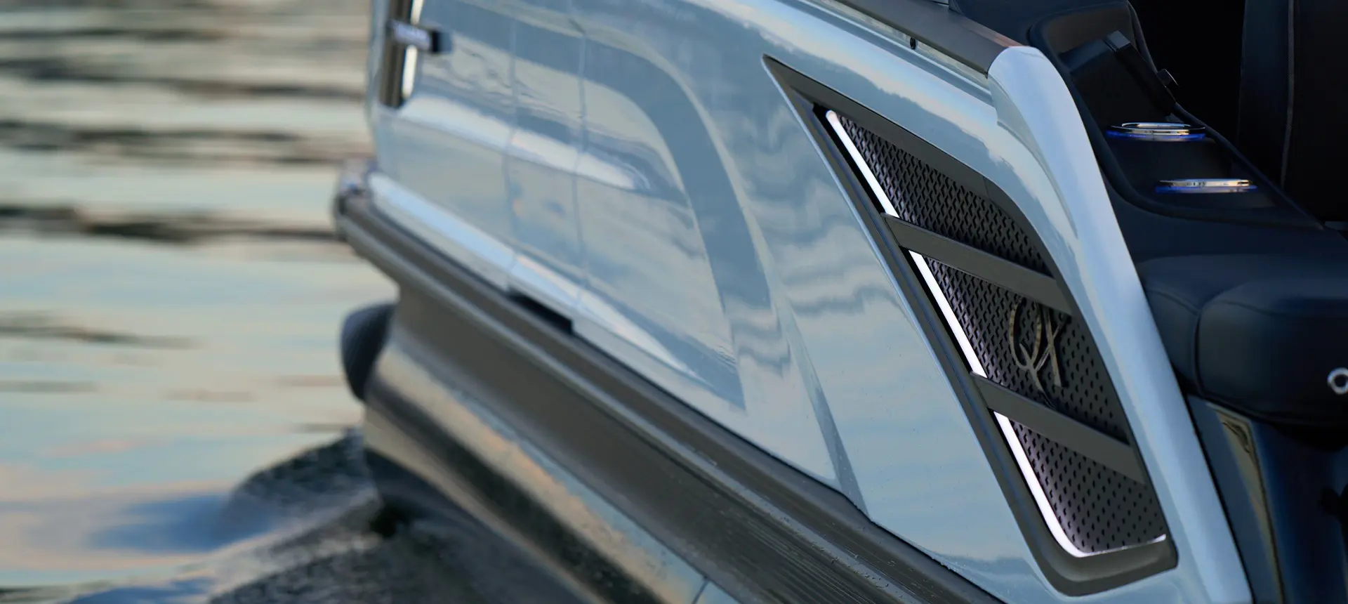 Premium badging on the sidewalls of a Bennington QX line pontoon boat.
