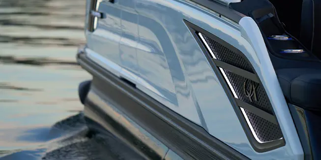 Premium badging on the sidewalls of a Bennington QX line pontoon boat.