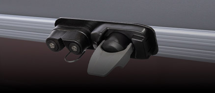 Man sliding pontoon boat attachment system accessory into rail channel. 