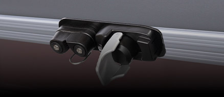 Man sliding pontoon boat attachment system accessory into rail channel. 
