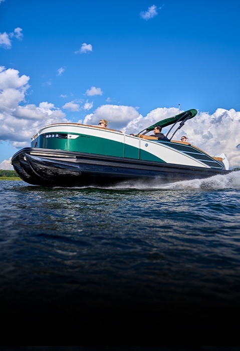Bennington pontoon boat with customized exterior colors and premium features cruising across the water.