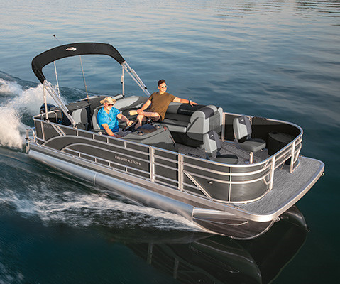 2 men speeding across lake on a Bennington S One Pontoon Boat. 