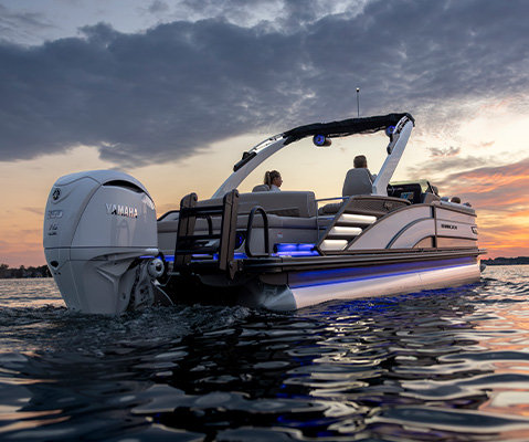 Aerial view of the RGB accent lighting under the stern seats on a Bennington R Line pontoon boat.