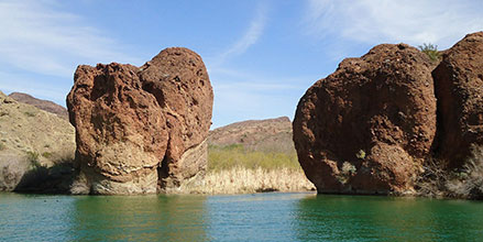Boulders standing at the edge of a lake
